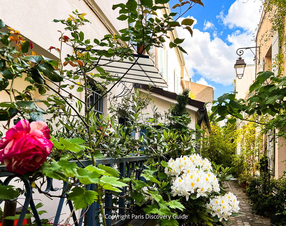 One of the many hidden garden-lined passages in Paris's Charonne neighborhood in the 20th
