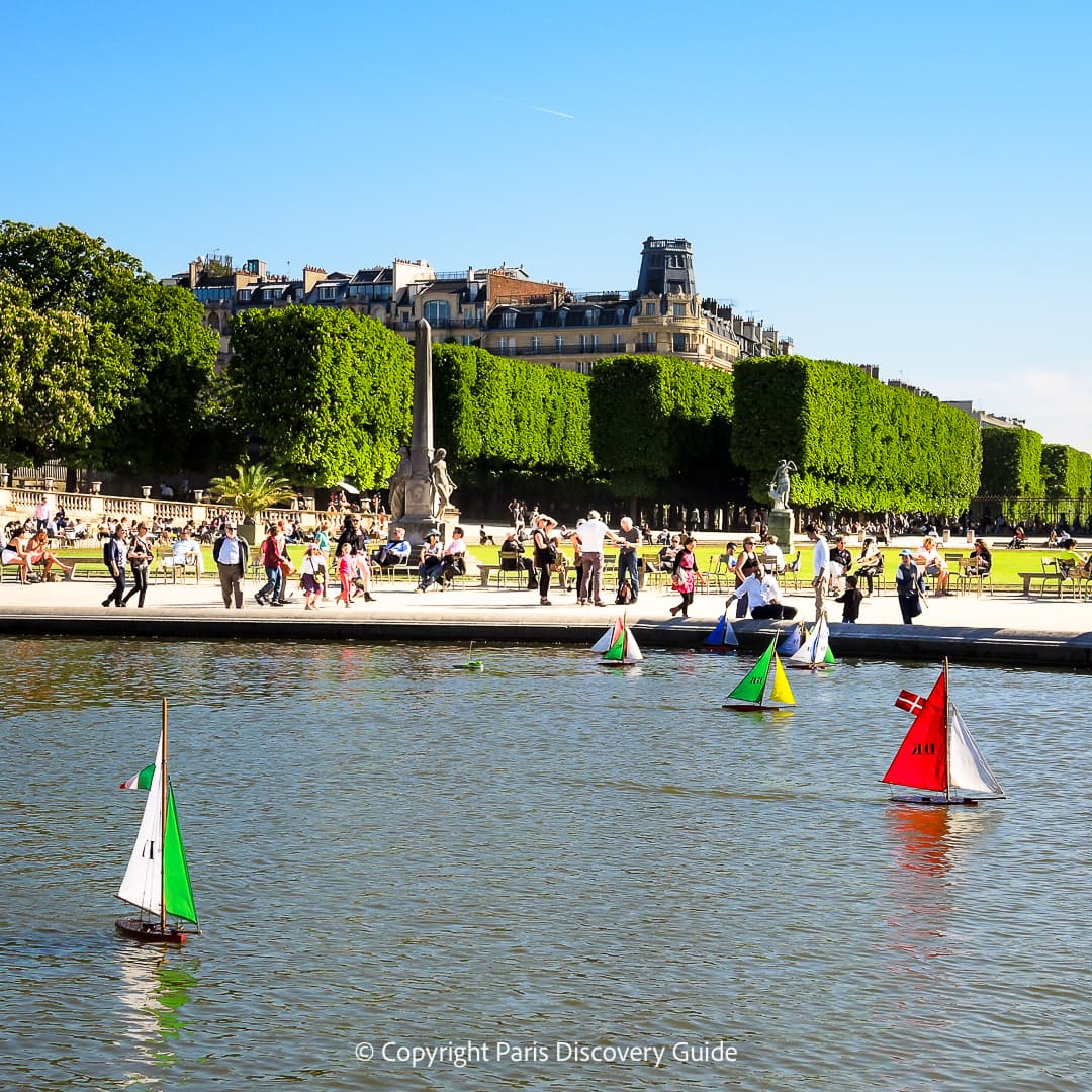 Toy sailboats on the reflecting pool in Luxembourg Garden