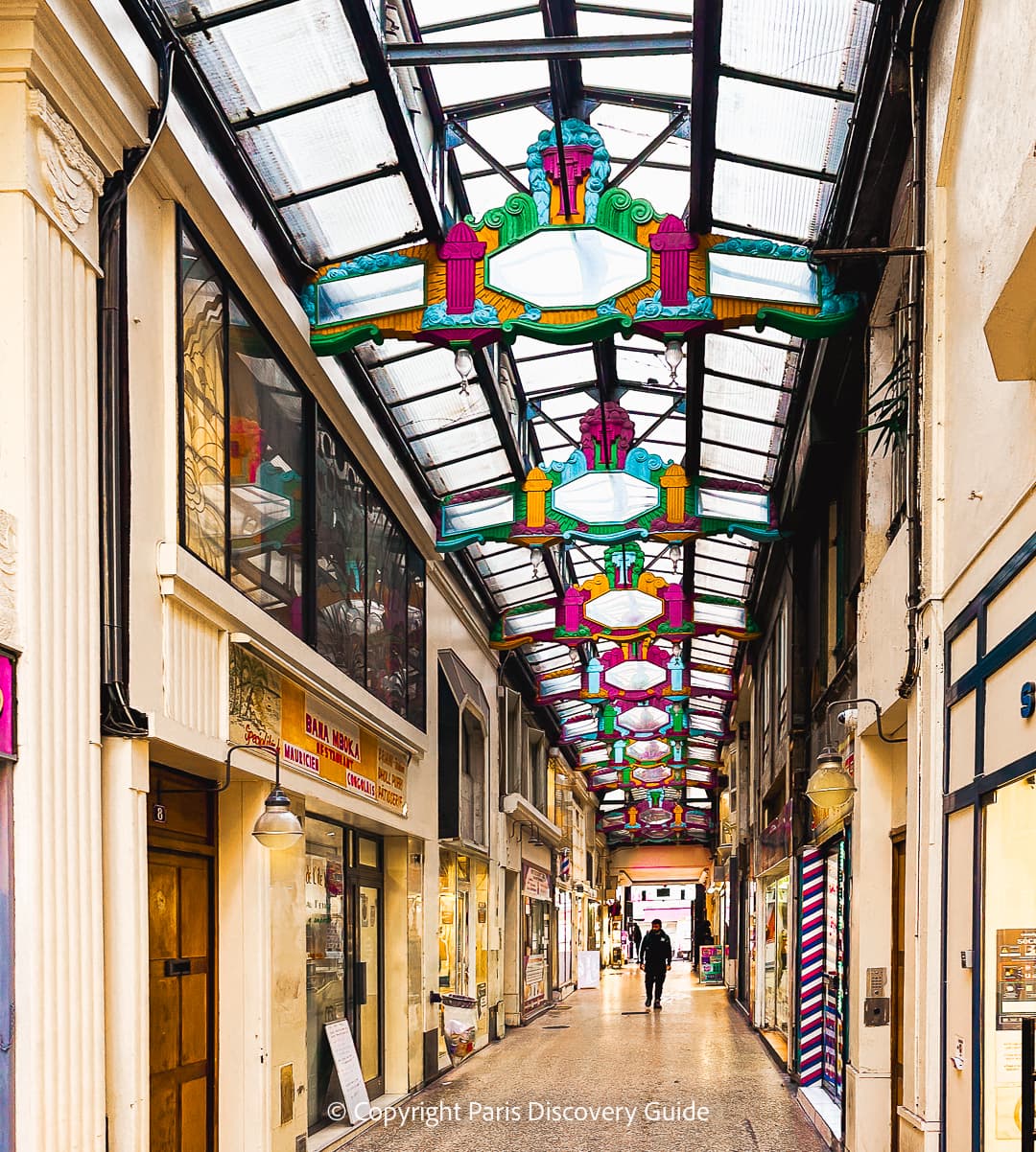 Passage du Prado, with painted Art Deco ornamentation along the ceiling trusses