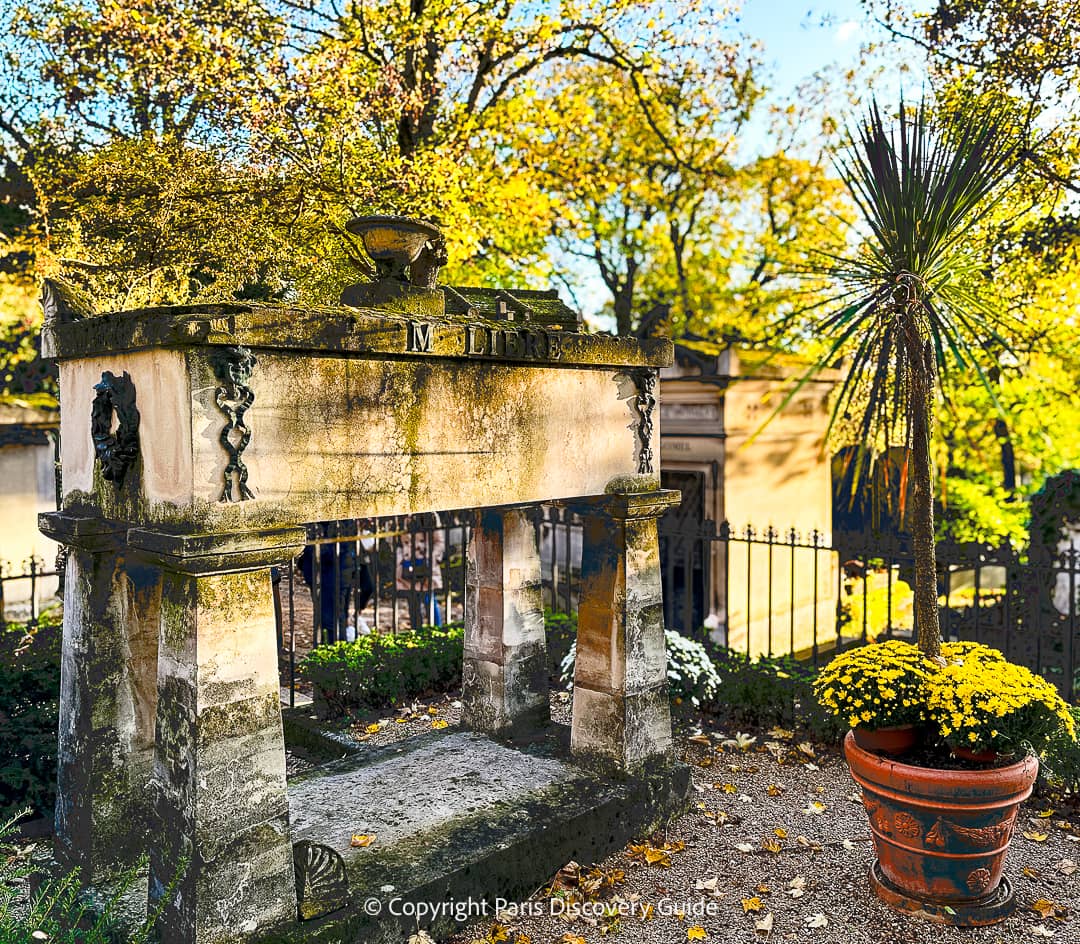 Tomb of famous 17th century French playwright, actor, and poet Moliere (Jean-Baptiste Poquelin) with Toussaint flowers 