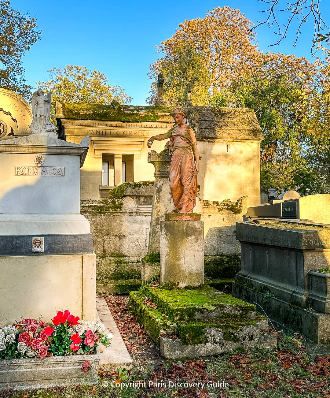 Planter filled with roses on All Saints Day in Pere Lachaise Cemetery