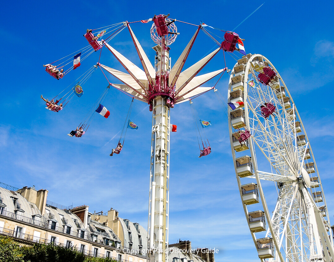 Giant ferris wheel and thrill ride at Tuileries Garden Carnival