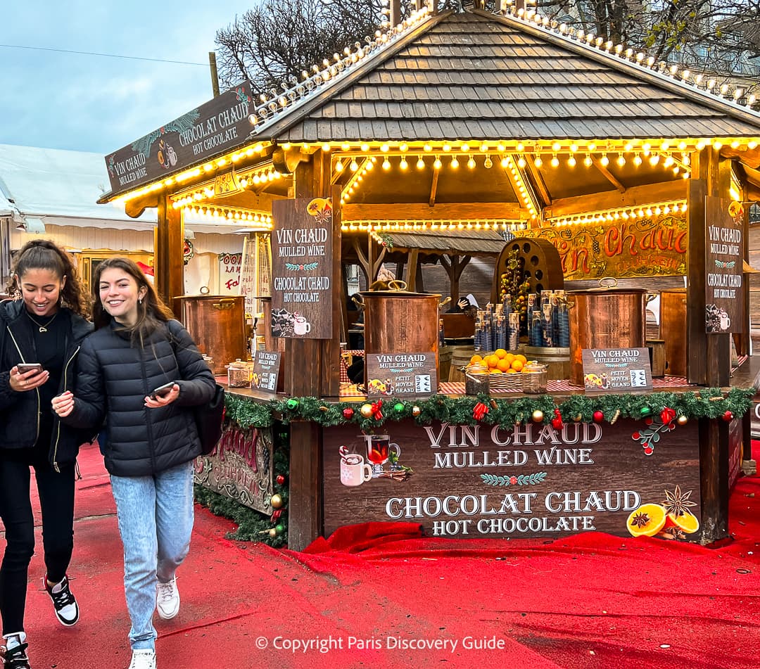 Tuileries Christmas Market chalet offering hot mulled wine and hot chocolate