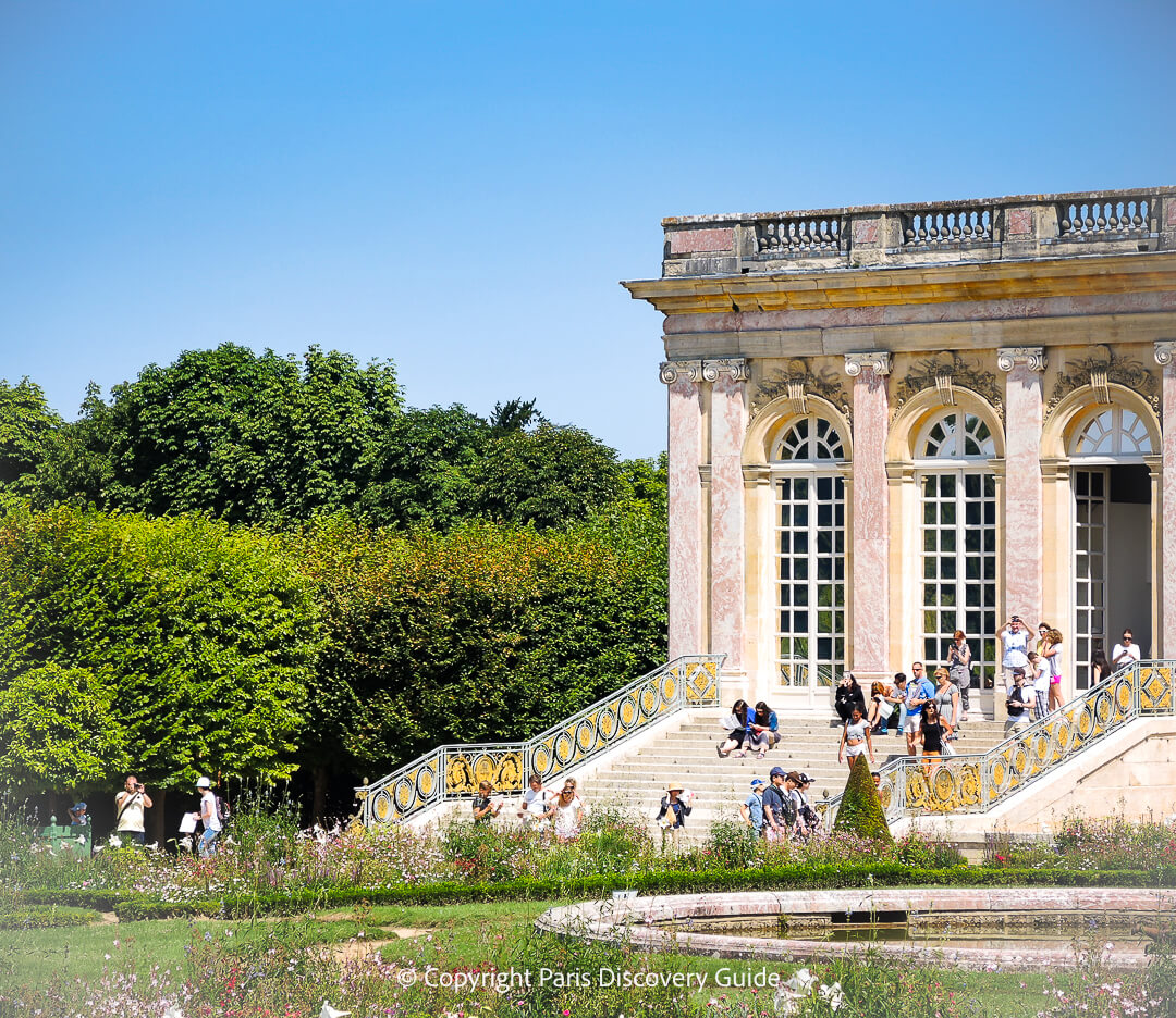 Grand Trianon in July, with summer flowers blooming in the garden