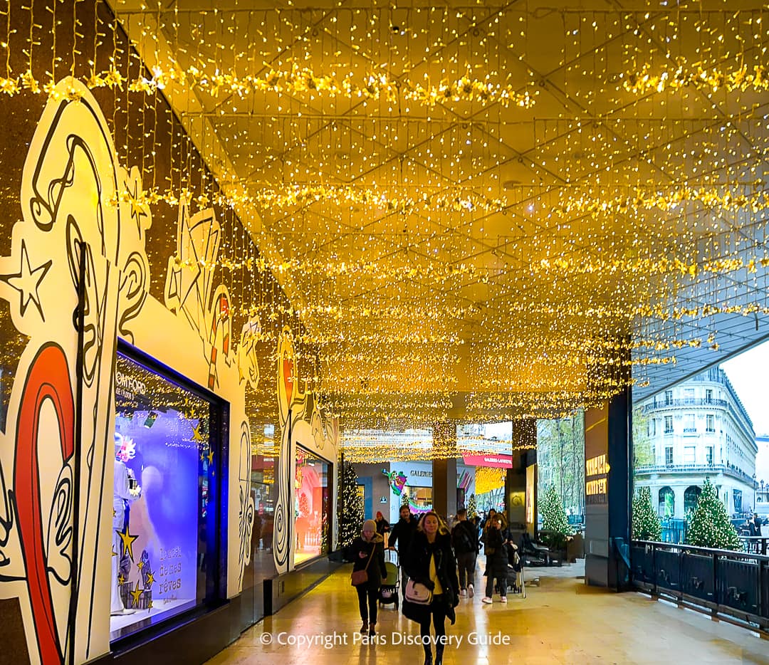 Galeries Lafayette Christmas window in the store's covered arcade facing Boulevard Haussmann 