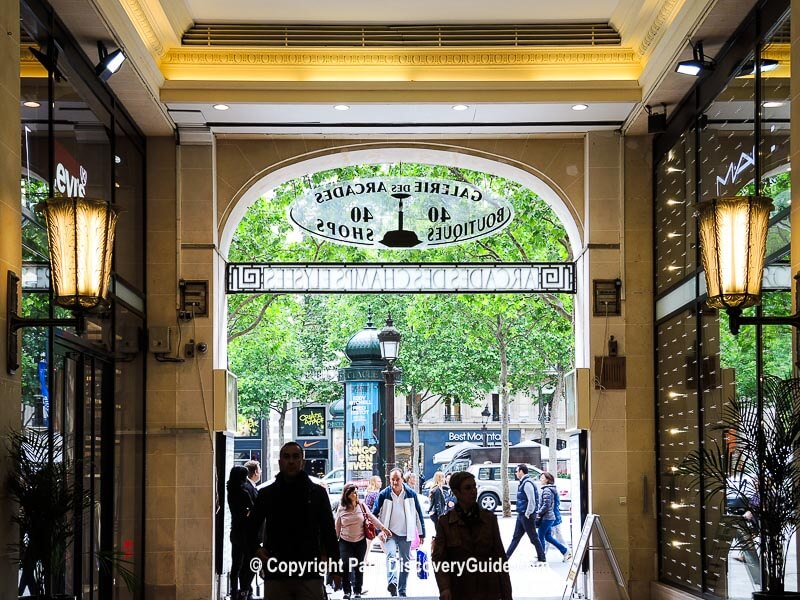 People line up as they wait to get in the Louis Vuitton shop on the Champs  Elysee avenue in Paris, Wednesday, May 19, 2021. Shops, cafe and restaurant  terraces reopened Wednesday after