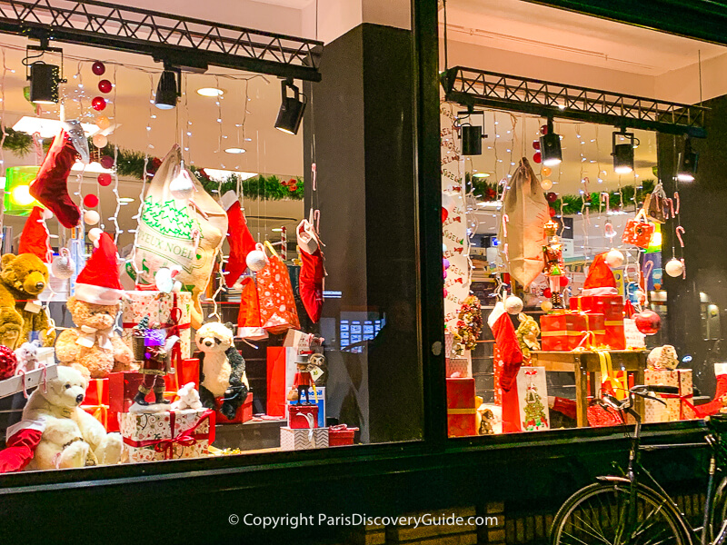 Paris, France - December 29, 2022: Christmas windows Louis Vuitton -  decoration with samples of jewelry and watches - holiday discounts Stock  Photo