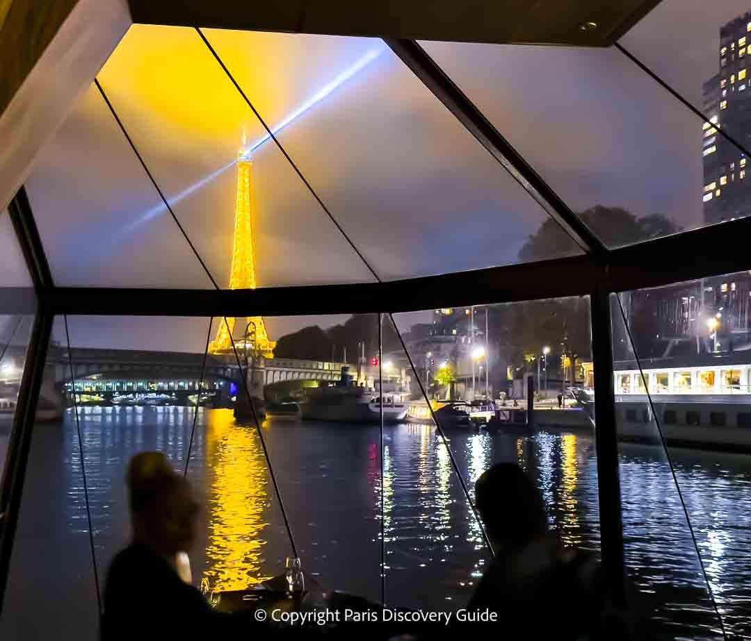 View of the Eiffel Tower from the front of a Seine River dinner cruise on a Bateau Mouches boat 