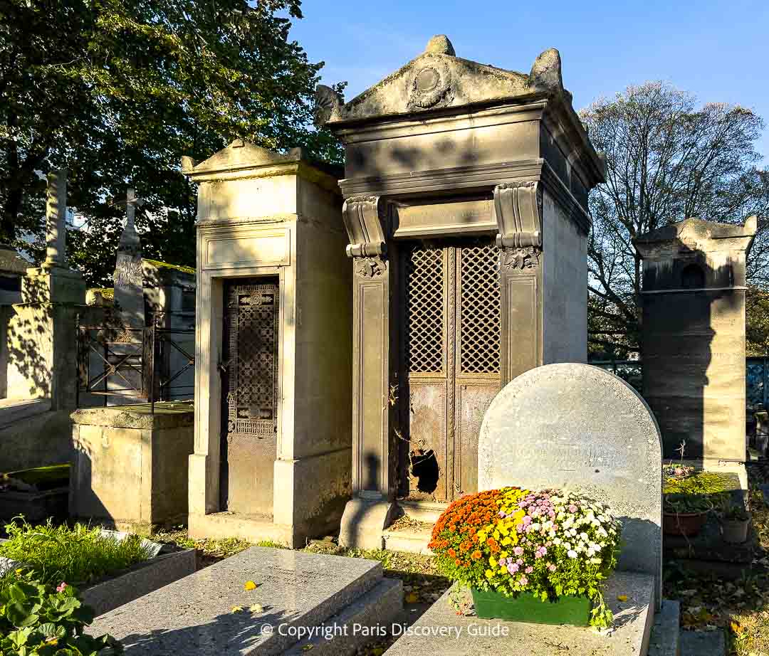 Touissaint flowers by a grave at Montmartre Cemetery