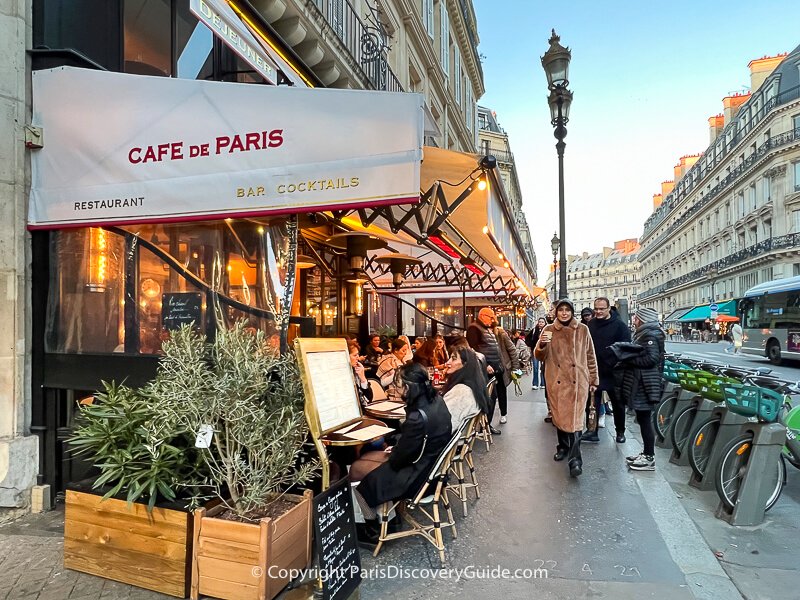 Sidewalk tables at a cafe near the Louvre Museum