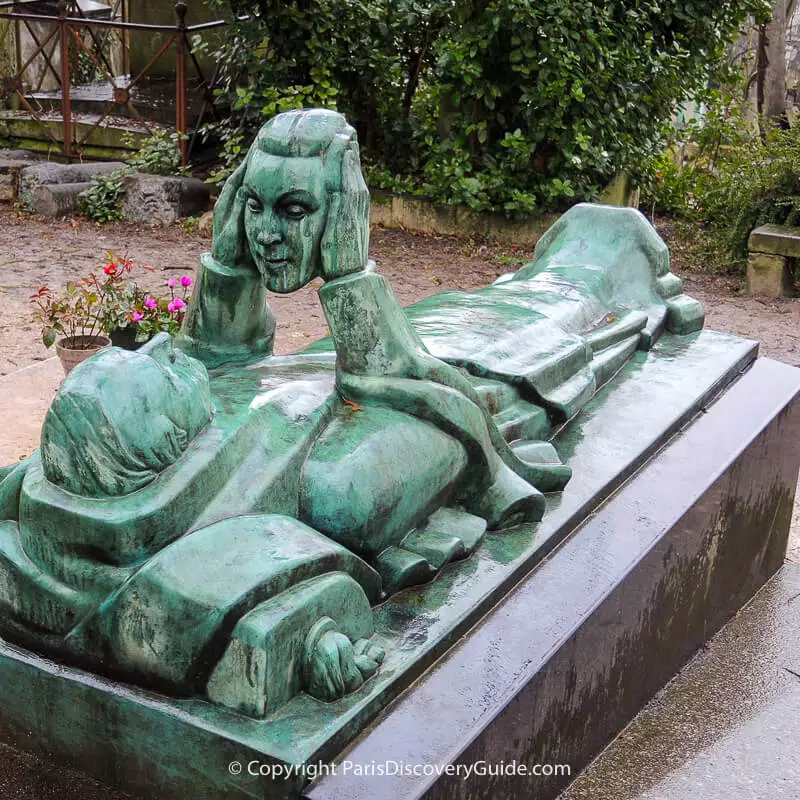 Grave of Fernand Arbelot, gazing at a mask representing his wife